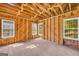 Light-filled room with wood framing, paneling, hardwood floors, and multiple windows, ready for customization at 2255 Beecher Sw Rd, Atlanta, GA 30311