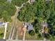 Aerial view of a residential property with mature trees and well-manicured lawns at 1293 Coan Dr, Locust Grove, GA 30248
