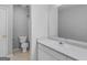 Bathroom with white vanity, toilet, shower, and neutral flooring, recently cleaned at 1293 Coan Dr, Locust Grove, GA 30248
