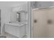 Bathroom with double sink vanity, large mirror, shower, and neutral flooring, recently cleaned at 1293 Coan Dr, Locust Grove, GA 30248