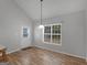Bright dining area with view to the outside. Features a pendant light and a door at 1293 Coan Dr, Locust Grove, GA 30248
