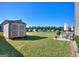 Backyard with a shed, patio furniture, grill, and a large lawn offers space for outdoor activities at 1058 Hartwell Rd, Locust Grove, GA 30248