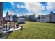 Expansive backyard features a patio with seating, a shed, and lush greenery, ideal for outdoor enjoyment at 1058 Hartwell Rd, Locust Grove, GA 30248