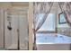 Bathroom showcasing a soaking tub, glass shower, and stylish tile accents at 1058 Hartwell Rd, Locust Grove, GA 30248