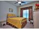 Cozy bedroom with bright window, floral curtains, and comfortable yellow bedding at 1058 Hartwell Rd, Locust Grove, GA 30248