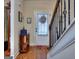 Charming entryway with decorative wreath on the front door and a view of the staircase at 1058 Hartwell Rd, Locust Grove, GA 30248