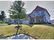 Two-story home featuring a well-manicured lawn, brick accents, and a charming, inviting facade at 1058 Hartwell Rd, Locust Grove, GA 30248