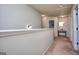 Bright hallway featuring neutral carpeting and access to multiple rooms at 1058 Hartwell Rd, Locust Grove, GA 30248