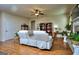 Bright living room showcasing hardwood floors, a ceiling fan, and a comfortable sofa at 1058 Hartwell Rd, Locust Grove, GA 30248