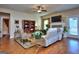Open living room features hardwood floors, a fireplace, and access to other living spaces at 1058 Hartwell Rd, Locust Grove, GA 30248