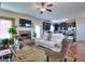 Spacious living room with a brick fireplace, hardwood floors, and open access to the kitchen at 1058 Hartwell Rd, Locust Grove, GA 30248