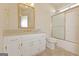 Bathroom features a vanity with gold hardware, tiled floor, and shower-tub combination at 325 Autumn Glen Cir, Fayetteville, GA 30215
