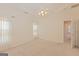 Bright, carpeted bedroom featuring ceiling fan and large window at 325 Autumn Glen Cir, Fayetteville, GA 30215