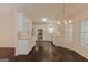 Modern kitchen with granite countertops, white cabinets, and stainless steel appliances at 325 Autumn Glen Cir, Fayetteville, GA 30215