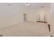 Spacious living room with vaulted ceilings, neutral carpet, and foyer view featuring the front door at 325 Autumn Glen Cir, Fayetteville, GA 30215