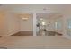 Bright living area with an open view to the dining and kitchen, neutral tones, and plenty of natural light at 325 Autumn Glen Cir, Fayetteville, GA 30215