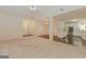 Open living area boasts vaulted ceilings, views of the kitchen, carpeted floors, and an inviting atmosphere at 325 Autumn Glen Cir, Fayetteville, GA 30215