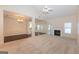 Bright living room with vaulted ceiling, fireplace, neutral carpet, and open views of the kitchen at 325 Autumn Glen Cir, Fayetteville, GA 30215