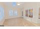 Sunroom featuring skylight, fan, tile floors and multiple windows at 325 Autumn Glen Cir, Fayetteville, GA 30215