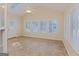 Bright sunroom with many windows, skylight, fan, and tile floors at 325 Autumn Glen Cir, Fayetteville, GA 30215