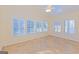 Bright sunroom with tile floors, many windows, and a ceiling fan at 325 Autumn Glen Cir, Fayetteville, GA 30215