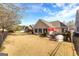Large backyard showing home, outdoor patio, black metal fence, and expansive grassy area at 365 Grand Teton Cir, Fayetteville, GA 30215