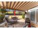 Outdoor patio featuring a red umbrella, seating, and a grill in a beautifully landscaped yard at 365 Grand Teton Cir, Fayetteville, GA 30215