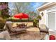 Back patio featuring a red umbrella and outdoor furniture at 365 Grand Teton Cir, Fayetteville, GA 30215