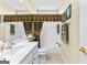 Bathroom featuring vanity, toilet, and shower-tub combo with patterned curtain at 365 Grand Teton Cir, Fayetteville, GA 30215