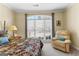 Bright bedroom features a comfortable chair and a large window, creating a serene and inviting atmosphere at 365 Grand Teton Cir, Fayetteville, GA 30215