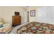Cozy bedroom with carpet, and a dresser holding a flat screen tv at 365 Grand Teton Cir, Fayetteville, GA 30215