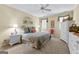 Cozy bedroom featuring a ceiling fan, two windows with white shutter panels, and a comfortable king bed at 365 Grand Teton Cir, Fayetteville, GA 30215