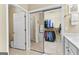 Walk-in closet featuring a mirrored door and ample storage space with hanging racks and shelves at 365 Grand Teton Cir, Fayetteville, GA 30215