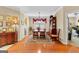 Dining room featuring hardwood floors, a dining set, and lots of decorative lighting at 365 Grand Teton Cir, Fayetteville, GA 30215