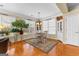 Bright dining room with wood floors, white trim, and a lovely pendant light fixture at 365 Grand Teton Cir, Fayetteville, GA 30215