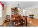 Dining room featuring hardwood floors, a dining set, china cabinet, and lighting at 365 Grand Teton Cir, Fayetteville, GA 30215
