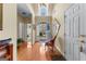 Grand foyer features hardwood floors, elegant lighting, and a view of the outdoors at 365 Grand Teton Cir, Fayetteville, GA 30215