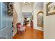 Elegant foyer showcases gleaming hardwood floors and a peek into the living spaces, complemented by tasteful decor at 365 Grand Teton Cir, Fayetteville, GA 30215