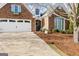 Charming brick home with a two-car garage, a welcoming front entrance, and a meticulously maintained landscape at 365 Grand Teton Cir, Fayetteville, GA 30215