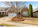 Charming brick home with well-manicured landscaping, a two-car garage, and inviting curb appeal at 365 Grand Teton Cir, Fayetteville, GA 30215