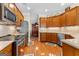 Charming kitchen features stainless steel appliances and hardwood floors at 365 Grand Teton Cir, Fayetteville, GA 30215