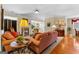 Elegant living room showcasing comfortable seating, a fireplace, and hardwood floors with natural light at 365 Grand Teton Cir, Fayetteville, GA 30215