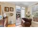 Inviting view from the living room to the outdoor stone patio beyond sliding glass doors at 365 Grand Teton Cir, Fayetteville, GA 30215