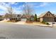 Street view showcases an attractive neighborhood featuring well-maintained lawns and charming brick facades at 365 Grand Teton Cir, Fayetteville, GA 30215