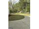 Spacious backyard featuring a chain link fence and concrete patio area at 248 Valley Way, Hampton, GA 30228