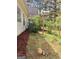 Backyard featuring a wooden pergola and mature landscaping near the house at 248 Valley Way, Hampton, GA 30228