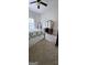 Bedroom with neutral decor featuring carpet flooring, natural light, and furniture at 248 Valley Way, Hampton, GA 30228