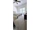 Cozy bedroom features carpet flooring and a window providing natural light at 248 Valley Way, Hampton, GA 30228