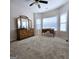Spacious bedroom with carpet, ceiling fan, and ample natural light from large windows at 248 Valley Way, Hampton, GA 30228