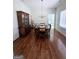 Bright dining room with hardwood floors, chandelier, and classic wooden china cabinet at 248 Valley Way, Hampton, GA 30228